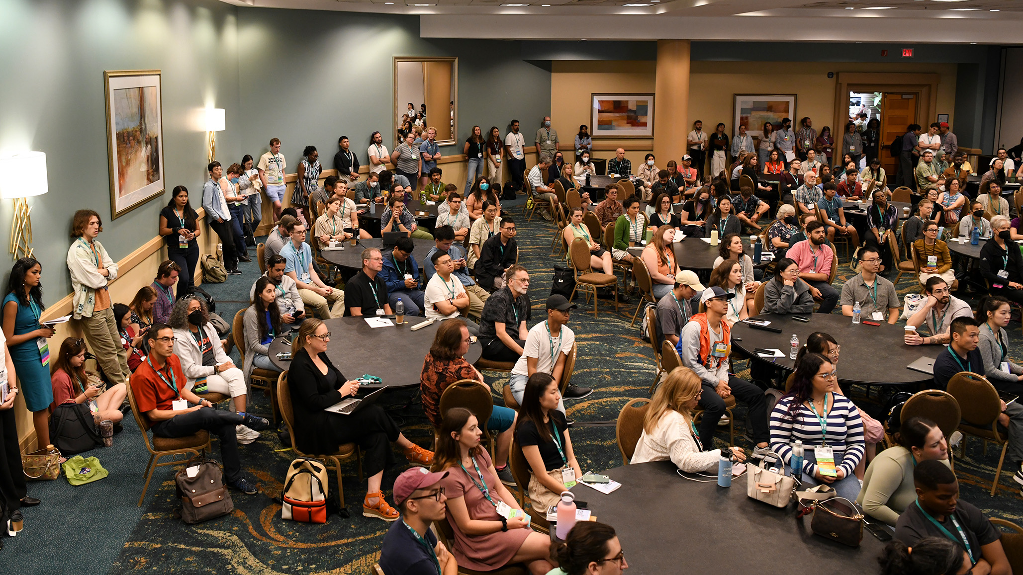 A large group in a crowded room.