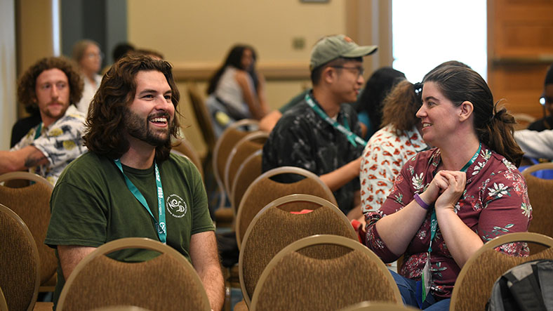 Two participants in the audience chat.