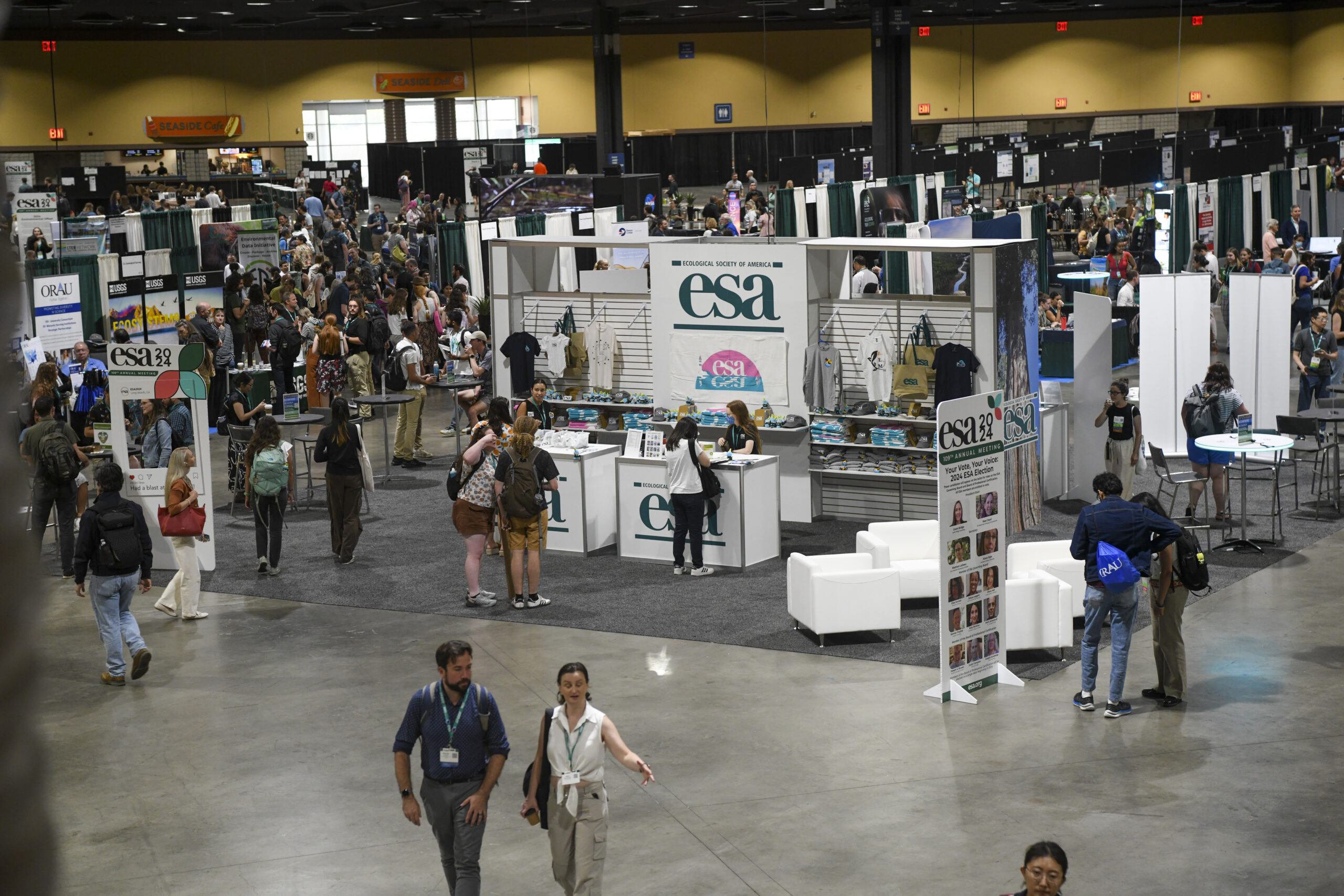 Two people exit the exhibit hall in Long Beach, CA.