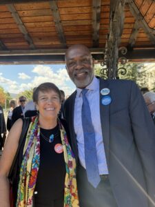 A man and woman smile for the camera.