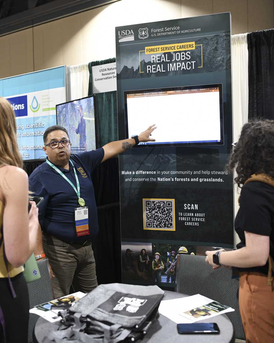 A presenter explains his organization.