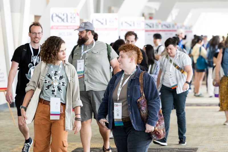 Attendees walk together.