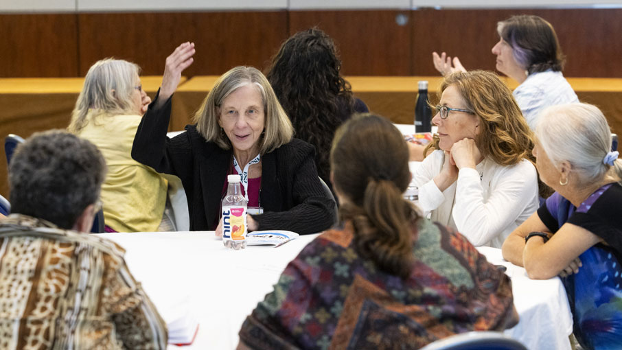 A participant at a discussion animates her point.