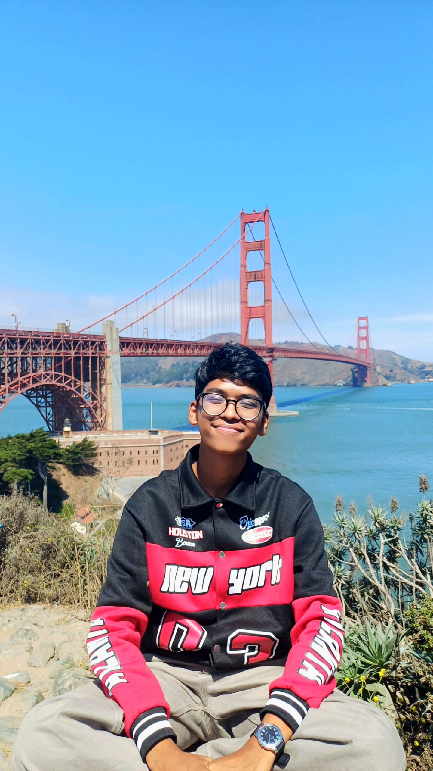 A winner stands before the Golden Gate Bridge in San Fransisco, California.