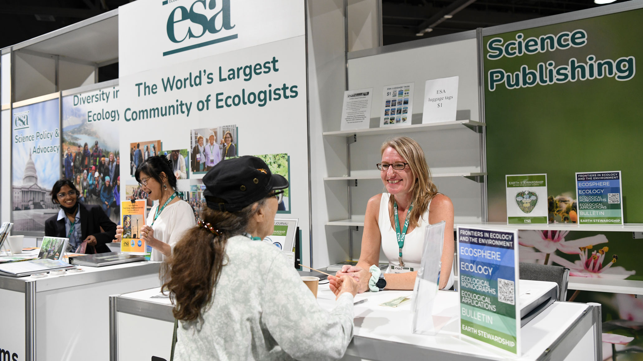 Heather speaks with an interested long time member of esa. 