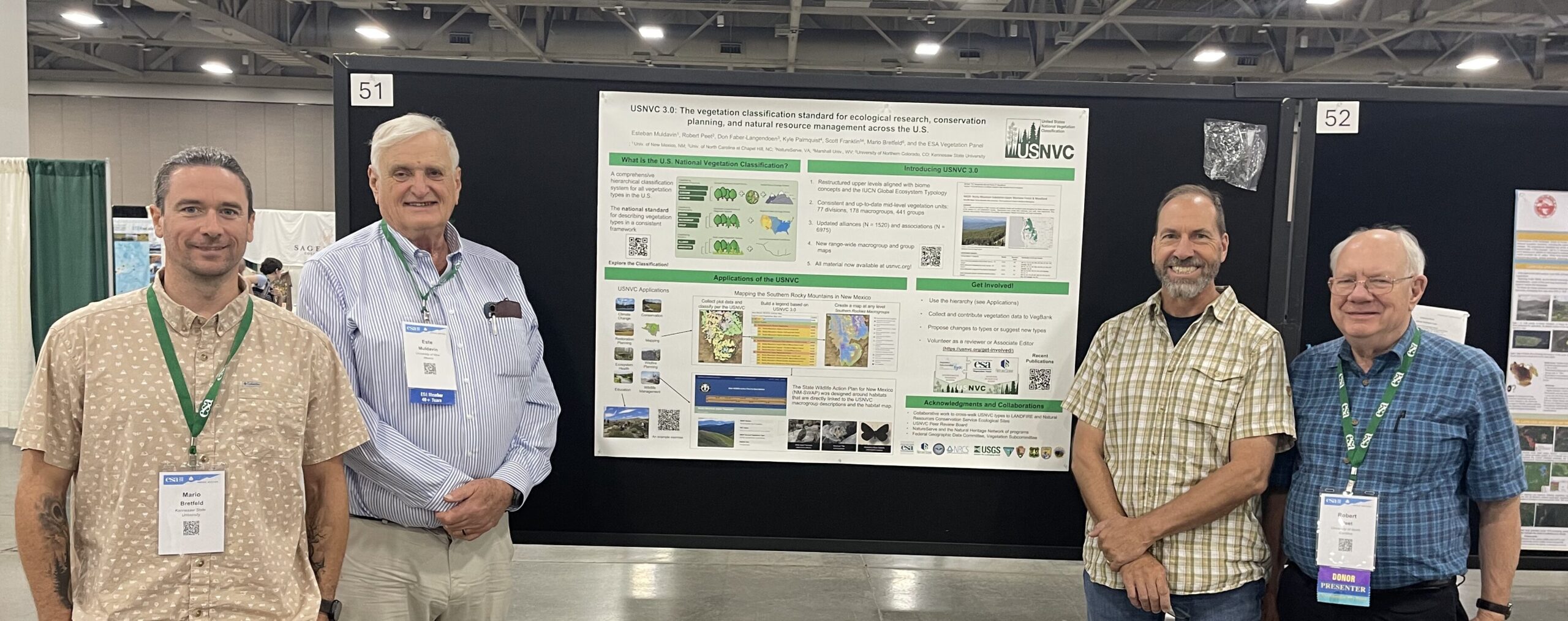 Photo of 4 scientist in front of poster at ESA 2026